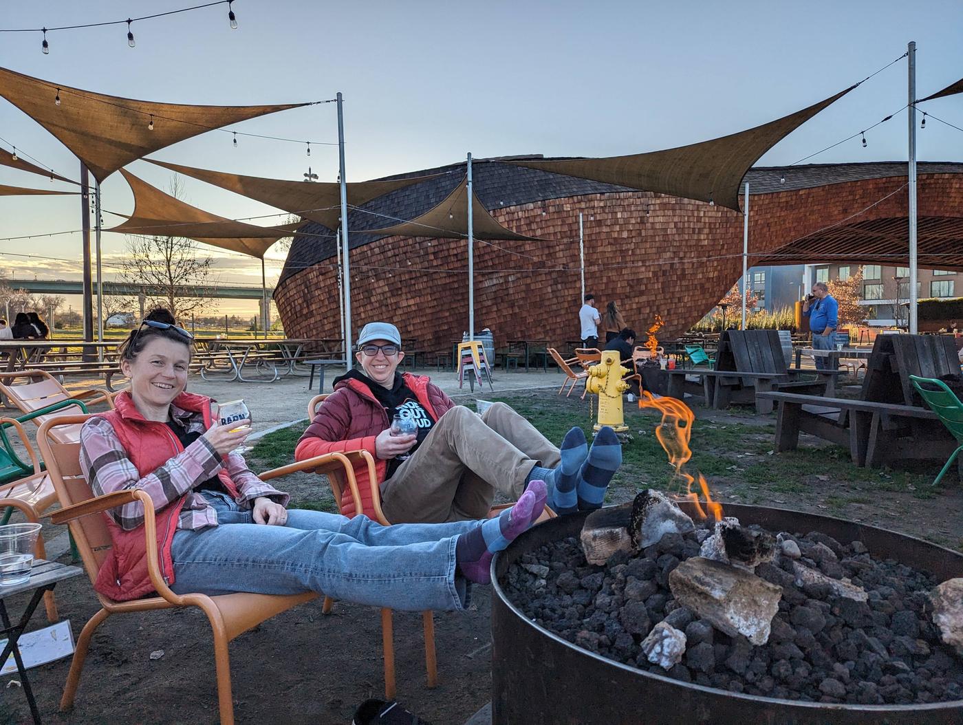 Chill outdoor vibes with beer, campfires, lawn games, picnic tables, and FOOD